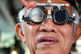 A man has his eyes checked at a government pavillion during a World Sight Day event in Pontianak, West Kalimantan, Indonesia October 12, 2017, in this photo taken by Antara Foto. Antara Foto/Jessica Helena Wuysang/via REUTERS ATTENTION EDITORS - THIS IMAGE WAS PROVIDED BY A THIRD PARTY. MANDATORY CREDIT. INDONESIA OUT. NO COMMERCIAL OR EDITORIAL SALES IN INDONESIA. TPX IMAGES OF THE DAY