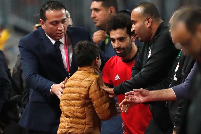 Soccer Football - African Nations Cup Qualifier - Egypt v Tunisia - Borg El Arab Stadium, Alexandria, Egypt - November 16, 2018 Egypt's Mohamed Salah talks to a young fan after the match REUTERS/Amr Abdallah Dalsh