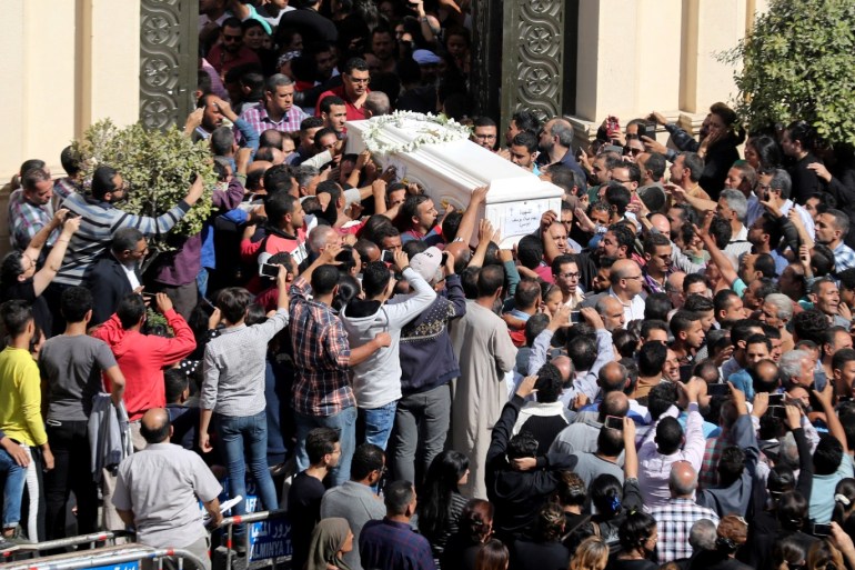 Mourners carry a coffin during the funeral of Coptic Christians who were killed in an attack, in Minya, Egypt November 3, 2018. REUTERS/Mohamed Abd El Ghany