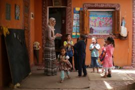 School teachers Omaima Eid and Eman Saeid play with students in Nile River school where young children are taught the basics of self-development through languages and various crafts in Al-Ayyat district southern of Cairo, Egypt April 29, 2018. Picture taken April 29, 2018. REUTERS/Amr Abdallah Dalsh