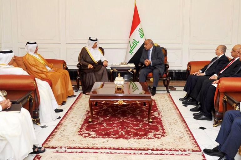 A handout photo made available by Iraqi Prime Minister office shows Iraqi Prime Minister Adil Abdul-Mahdi (C-R) meeting with Qatari Deputy Prime Minister and Minister of Foreign Affairs Sheikh Mohamed bin Abdulrahman Al Thani (C-L)