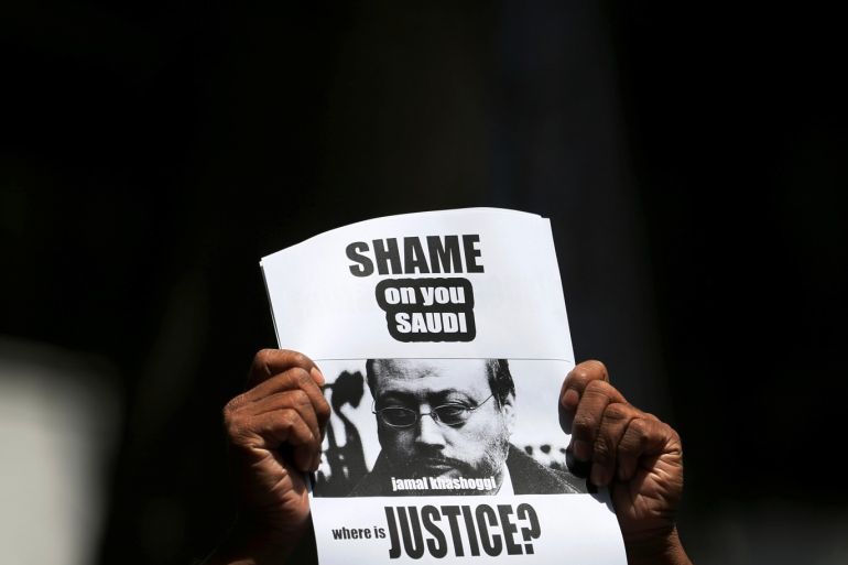 A member of Sri Lankan web journalist association holds a placard during a protest condemning the murder of slain journalist Jamal Khashoggi in front of the Saudi Embassy in Colombo, Sri Lanka October 25, 2018. REUTERS/Dinuka Liyanawatte