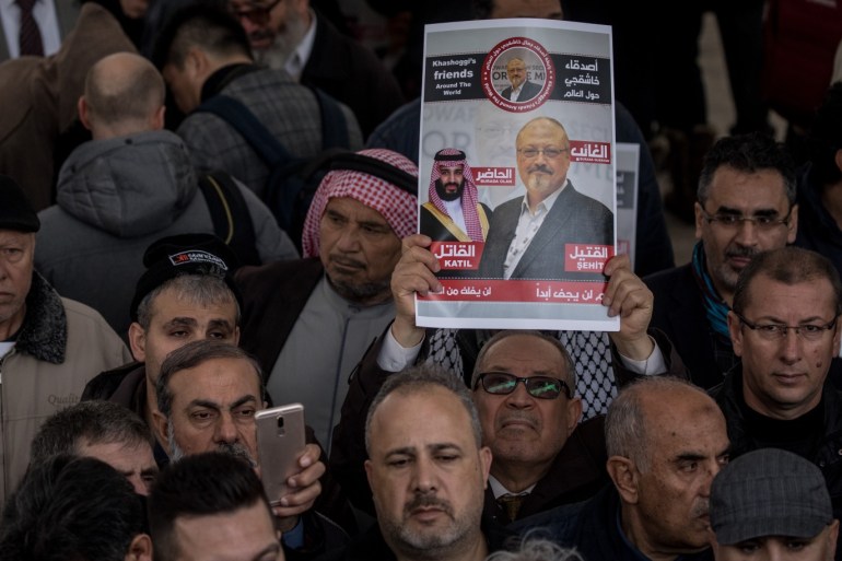ISTANBUL, TURKEY - NOVEMBER 16: A man holds a poster showing a picture of Jamal Khashoggi after taking part in an absence prayer held after Friday pray at Fatih Mosque on November 16, 2018 in Istanbul Turkey. Khashoggi was killed on October 2, 2018 after entering the Saudi Consulate in Istanbul to finalize papers for his marriage, sparking a weeks long investigation and creating diplomatic tension between, Turkey, the U.S and Saudi Arabia. His body is still yet to be re