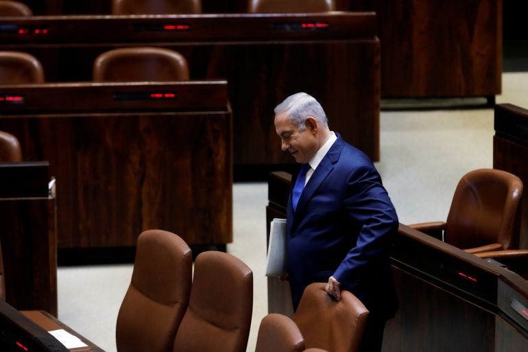 Israeli Prime Minister Benjamin Netanyahu arrives to the plenum of the Knesset, the Israeli Parliament, in Jerusalem, March 12, 2018. REUTERS/Ronen Zvulun