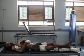 Al KHAWKHAH, YEMEN - SEPTEMBER 22: Sadam Khadam Mahdi, 27, lies on a bed in a field hospital on September 22, 2018 in Al Khawkhah, Yemen. Mahdi was visiting a neighbor in the frontline town of Haiz when he was hit by an incoming mortar. A coalition military campaign has moved west along Yemen's coast toward Hodeidah, where increasingly bloody battles have killed hundreds since June, putting the country's fragile food supply at risk. (Photo by Andrew Renneisen/Getty Images)