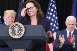 LANGLEY, VA - MAY 21: Gina Haspel prepares to speak while flanked by U.S. President Donald Trump (L) and Vice President Mike Pence, after she was sworn in as CIA director during a swearing-in ceremony at agency headquarters, May 21, 2018 in Langley, Virginia. Last week the Senate confirmed Haspel to replaced Mike Pompeo who was sworn in as Secretary of State earlier this month. Mark Wilson/Getty Images/AFP== FOR NEWSPAPERS, INTERNET, TELCOS & TELEVISION USE ONLY ==