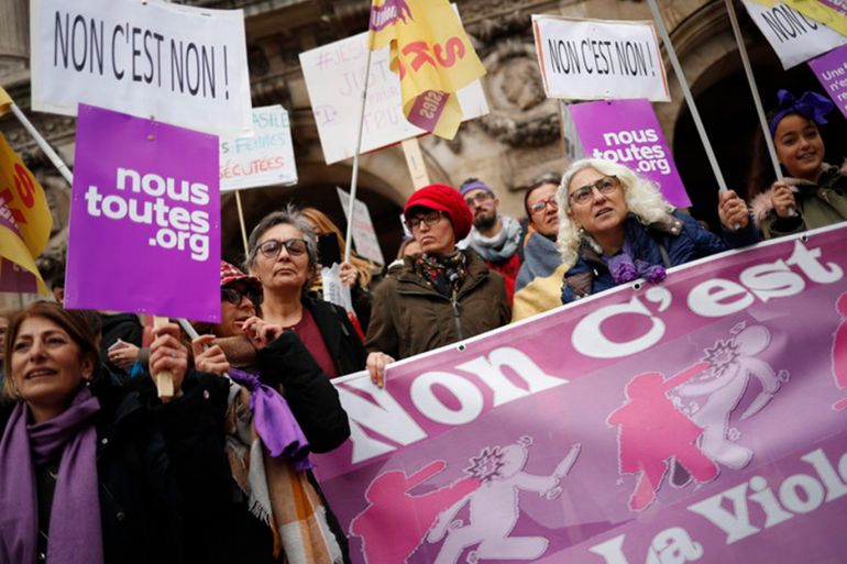 epa07186430 Women hold placards with feminists' slogans during a rally against gender-based and sexual violence against women, in Paris, France, 24 November 2018. EPA-EFE/CHRISTOPHE PETIT TESSON
