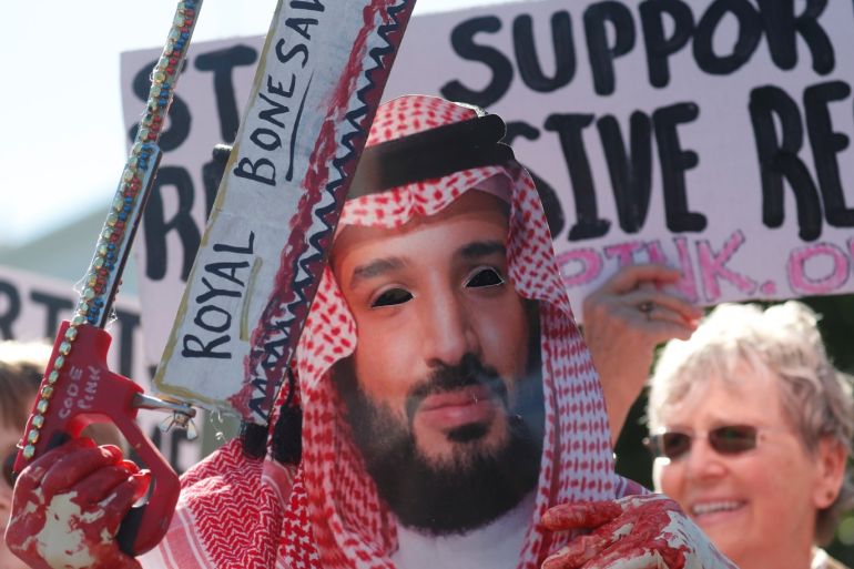 An activist dressed as Saudi Crown Prince Mohammad bin Salman holds a prop bonesaw during a demonstration calling for sanctions against Saudi Arabia and to protest the disappearance of Saudi journalist Jamal Khashoggi, outside the White House in Washington, U.S., October 19, 2018. REUTERS/Leah Millis