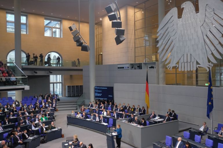 BERLIN, GERMANY - NOVEMBER 21: German Chancellor Angela Merkel speaks during debates over the next federal budget at the Bundestag on November 21, 2018 in Berlin, Germany. Merkel made an impassioned plea in support for the United Nations migration pact in her speech. (Photo by Sean Gallup/Getty Images)