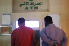 Customers use an automated teller machine (ATM) in Khartoum, Sudan November 8, 2018. Picture taken November 8, 2018. REUTERS/Mohamed Nureldin Abdallah