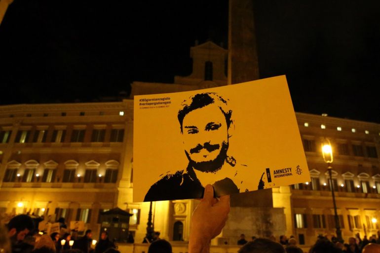 REFILE-CORRECTING BYLINE A man holds a placard during a vigil to commemorate Giulio Regeni, who was found murdered in Cairo a year ago, in downtown Rome, Italy January 25, 2017. REUTERS/Alessandro Bianchi