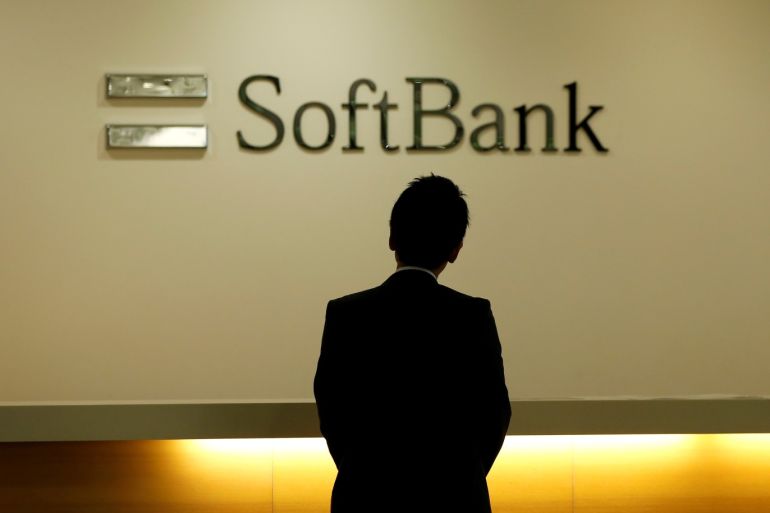 A man looks at the logo of SoftBank Group Corp at the company's headquarters in Tokyo, June 30, 2016. REUTERS/Toru Hanai