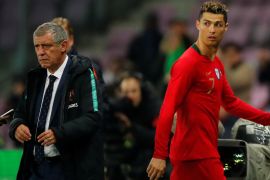 Soccer Football - International Friendly - Portugal vs Netherlands - Stade de Geneve, Geneva, Switzerland - March 26, 2018 Portugal's Cristiano Ronaldo walks off after being substituted as Portugal coach Fernando Santos looks on REUTERS/Denis Balibouse