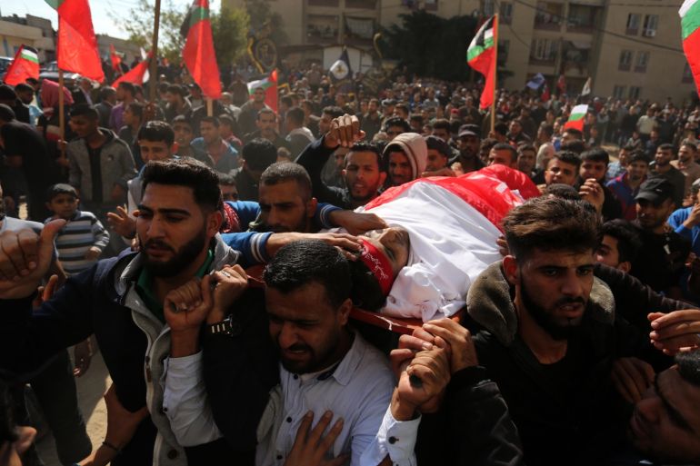 Funeral ceremony of Palestinian in Gaza- - BEIT LAHIA, GAZA - NOVEMBER 13: (EDITOR'S NOTE: Image depicts death) Palestinians carry the dead body of Palestinian Mohammed Awde, 22, who was killed in Israeli attacks on the Gaza Strip, during his funeral ceremony in Beit Lahia, Gaza on November 13, 2018.