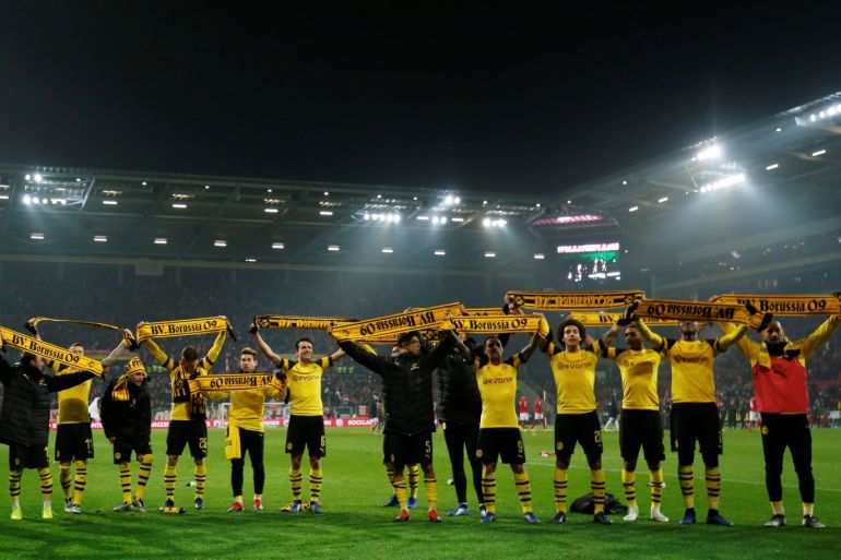 Soccer Football - Bundesliga - 1.FSV Mainz 05 v Borussia Dortmund - Opel Arena, Mainz, Germany - November 24, 2018 Borussia Dortmund players celebrate in front of their fans at the end of the match REUTERS/Ralph Orlowski DFL regulations prohibit any use of photographs as image sequences and/or quasi-video