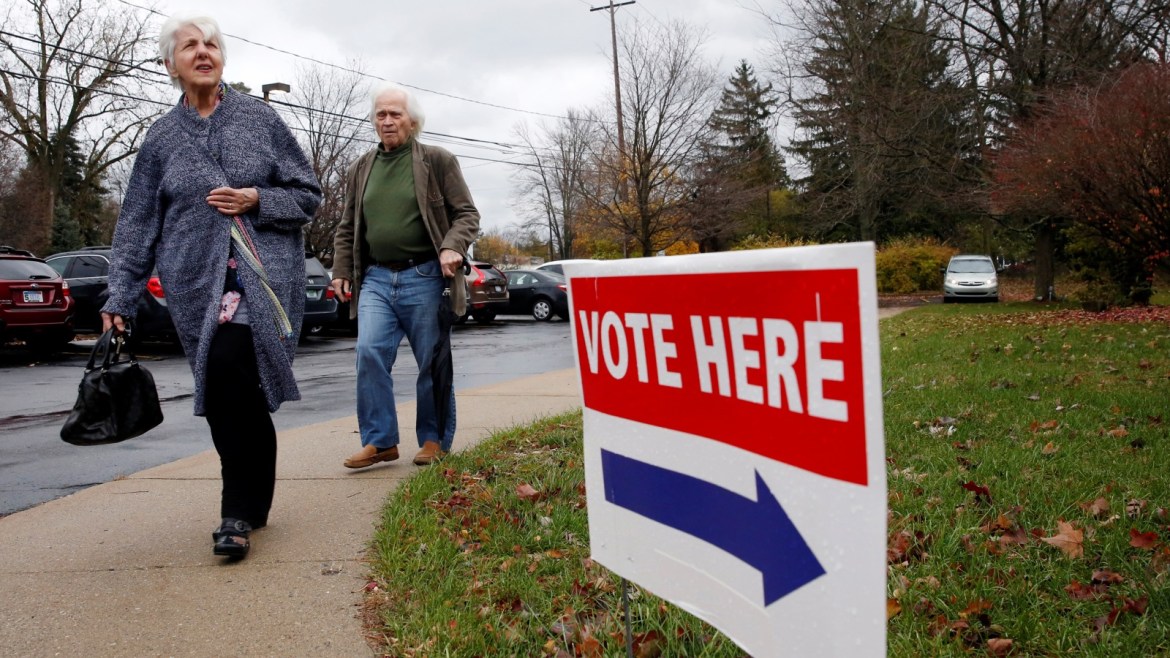 Marinna and Gerasimys Karbatsos arrive to  vote in the midterm election at the St. Paul Lutheran Church in East Lansing, Michigan, U.S. November 6, 2018. REUTERS/Jeff Kowalsky