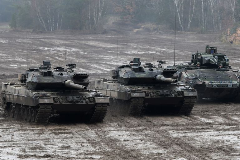 MUNSTER, GERMANY - DECEMBER 06: The battle tank Leopard 2 (L-C) and the armored personnel carrier Puma (R) of the German Bundeswehr during a training at the Bundeswehr infantry training facility on December 6, 2018 in Munster, Germany. Germany is increasing its annual defense budget following reports over recent years of a large portion of its military planes, ships, tanks and other weaponry as grounded due to lack of spare parts. (Photo by David Hecker/Getty Images)