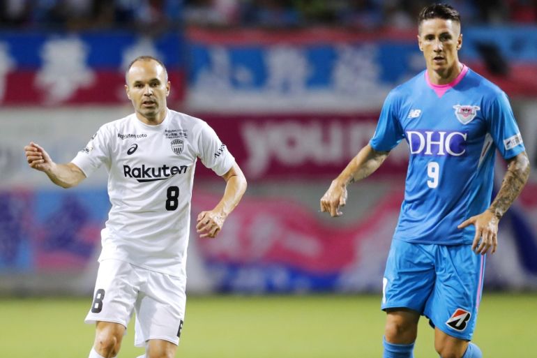 Vissel Kobe's Andres Iniesta and Sagan Tosu's Fernando Torres are pictured during the Emperor's Cup soccer match in Tosu, Saga Prefecture, Japan in this photo taken by Kyodo on August 22, 2018. Mandatory credit Kyodo/via REUTERS ATTENTION EDITORS - THIS IMAGE WAS PROVIDED BY A THIRD PARTY. MANDATORY CREDIT. JAPAN OUT. NO COMMERCIAL OR EDITORIAL SALES IN JAPAN.