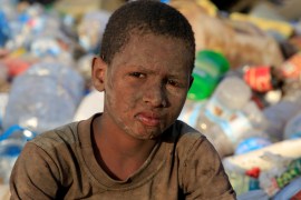Ayoub Mohammed Ruzaiq, 11, poses for a photograph at a garbage dump where he collects recyclables and food near the Red Sea port city of Hodeidah, Yemen, January 13, 2018.
