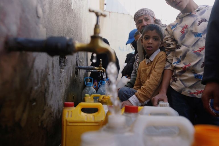 People collect drinking water from charity tap amid fears of a new cholera outbreak in Sanaa, Yemen November 5, 2018. Picture taken November 5, 2018. REUTERS/Khaled Abdullah