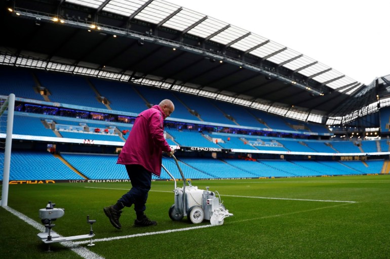 Soccer Football - Premier League - Manchester City v AFC Bournemouth - Etihad Stadium, Manchester, Britain - December 1, 2018 Ground staff perform maintenance on the pitch before the match REUTERS/Phil Noble EDITORIAL USE ONLY. No use with unauthorized audio, video, data, fixture lists, club/league logos or