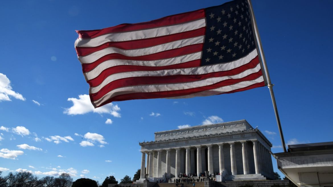 WASHINGTON, DC - DECEMBER 22: An American flag flies near the Lincoln Memorial on December 22, 2018 in Washington, DC. The government partially shutdown at midnight after congress failed to pass a spending bill.   Olivier Douliery/Getty Images/AFP== FOR NEWSPAPERS, INTERNET, TELCOS & TELEVISION USE ONLY ==