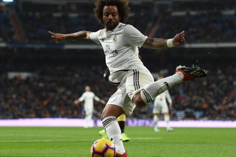MADRID, SPAIN - DECEMBER 15: Marcelo of Real Madrid passes the ball during the La Liga match between Real Madrid CF and Rayo Vallecano de Madrid at Estadio Santiago Bernabeu on December 15, 2018 in Madrid, Spain. (Photo by Denis Doyle/Getty Images)