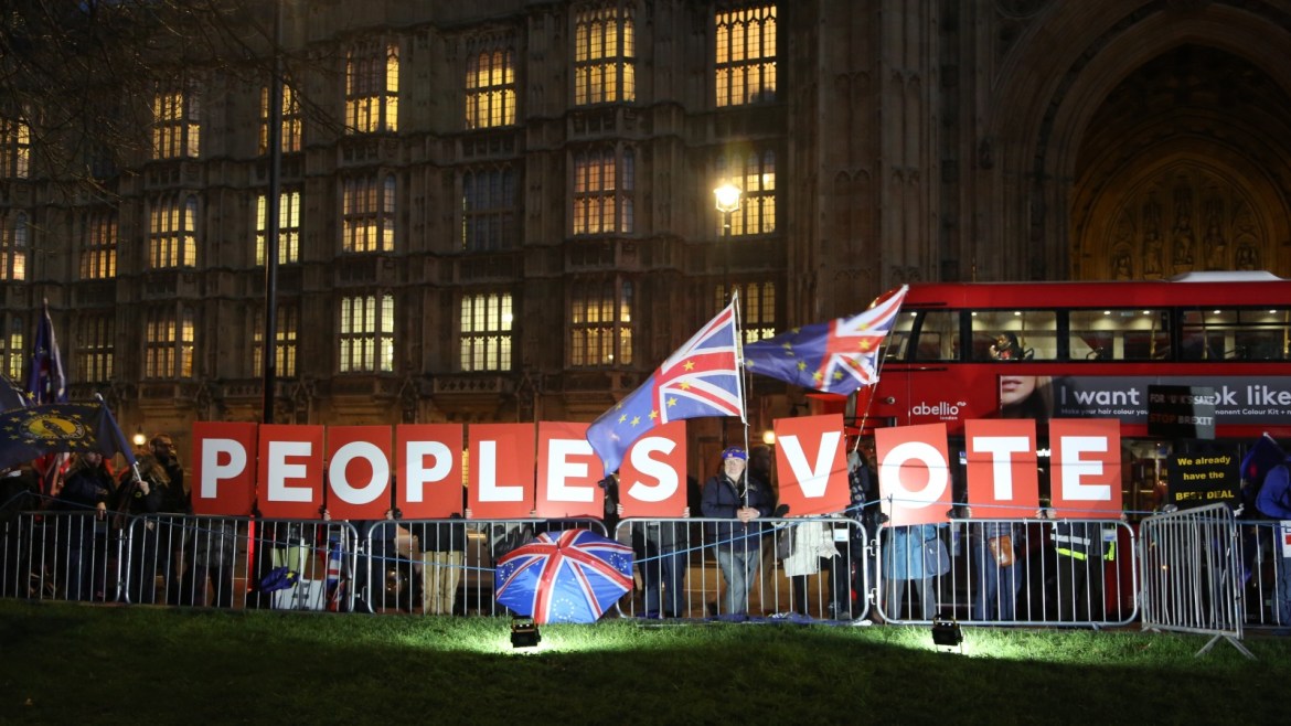 Protests outside of Westminster Palace as Brexit vote postponed- - LONDON, UNITED KINDOM - DECEMBER 11: Pro-brexit and pro-remain protesters continue to demonstrate outside UK parliament during evening after British Prime Minister Theresa May announced Monday the postponement of Tuesday’s planned Brexit vote, in London, United Kingdom on December 11, 2018.