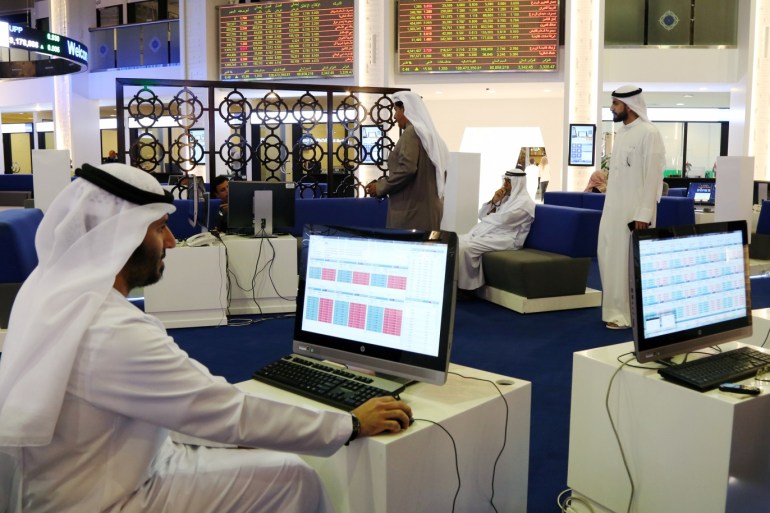 Investors are seen at the Dubai International Financial Market in Dubai, UAE February 7, 2018. REUTERS/Satish Kumar