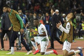 epa07190110 Players of Raja Club Athletic celebrate a goal during the CAF Confederation Cup final first leg, soccer match between Raja Club Athletic and AS Vita Club at Mohamed V Stadium in Casablanca, Morocco, 25 November 2018. Raja Club Athletic won 3-0. EPA-EFE/JALAL MORCHIDI