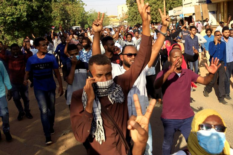 Sudanese demonstrators chant slogans as they march along the street during anti-government protests in Khartoum, Sudan December 25, 2018. REUTERS/Mohamed Nureldin Abdallah