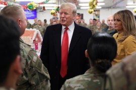 U.S. President Donald Trump and first lady Melania Trump greet military personnel at the dining facility during an unannounced visit to Al Asad Air Base, Iraq, December 26, 2018. REUTERS/Jonathan Ernst