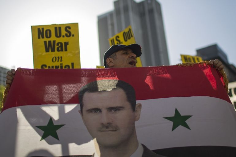 LOS ANGELES, CA - APRIL 14: Supporters of Syrian president Bashar al-Assad protest the U.S.-led coalition attack in Syria, on April 14, 2018 in Los Angeles, California. Air attacks were carried out by U.S., France and Britain forces last night on three sites in Syria believed to be associated with the production of chemical weapons, in response to the latest use of deadly gas on civilians. David McNew/Getty Images/AFP== FOR NEWSPAPERS, INTERNET, TELCOS & TELEVISION US
