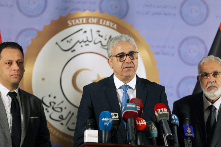 Interior Minister Fathi Ali Bashagha (C) speaks during a joint news conference with Foreign Minister Mohamed Taher Siala in Tripoli, Libya December 25, 2018. REUTERS/Hani Amara