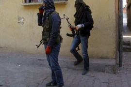 Masked members of YDG-H, youth wing of the outlawed Kurdistan Workers Party (PKK), stand at a corner in Sur neighbourhood of the southeastern city of Diyarbakir, Turkey, November 6, 2015. Kurdish militants scrapped a month-old ceasefire in Turkey on Thursday, a day after President Tayyip Erdogan vowed to