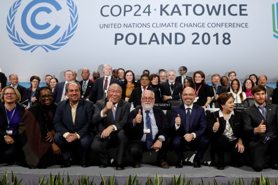 COP24 President Michal Kurtyka and Executive Secretary of the UN Framework Convention on Climate Change Patricia Espinosa pose with the heads of delegations after adopting the final agreement during a closing session of the COP24 U.N. Climate Change Conference 2018 in Katowice, Poland, December 15, 2018. REUTERS/Kacper Pempel