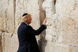 U.S. President Donald Trump touches the Western Wall, Judaism's holiest prayer site, in Jerusalem's Old City May 22, 2017. REUTERS/Ronen Zvulun