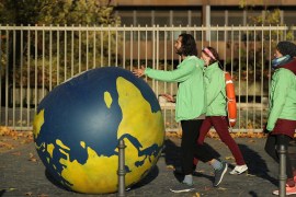 BONN, GERMANY - NOVEMBER 04: Climate change activists roll a rubber globe of the planet Earth following a march to demonstrate against coal energy and other climate-related issues on November 4, 2017 in Bonn, Germany. The march, organized by over a dozen environmental activist groups, takes place two days before the COP 23 United Nations climate conference due to begin on Monday in Bonn and run through November 16. (Photo by Sean Gallup/Getty Images)
