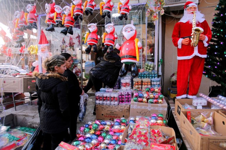 Christians shop at a store selling Christmas decorations in al-Hamdaniya, Iraq December 21, 2018. Picture taken December 21, 2018. REUTERS/Khalid al-Mousily