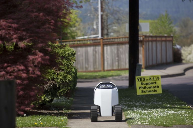 PHILOMATH, OR - APRIL 25: Delivery robot 'DAX' returns to base after successfully delivering burritos on April 25, 2018 in Philomath, Oregon. Joseph Sullivan, the inventor of DAX is a native of the small town. He says he plans to deploy 30 DAX-like robots to perform various delivery tasks in the next few months. Sullivan says with more Americans shopping online, delivery robots could reduce traffic and pollution. Natalie Behring/Getty Images/AFP== FOR NEWSPAPERS, INTERNET, TELCOS & TELEVISION USE ONLY ==