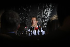 German former Formula One driver Michael Schumacher attends a news conference in Geneva August 12, 2009. Seven-time world champion Schumacher has cancelled plans of a temporary return to Formula One with Ferrari because of fitness concerns, the German driver said on Tuesday. The 40-year old who hurt his neck in a motorcycle accident earlier this year, was due to replace injured Felipe Massa, a job now going to test driver Luca Badoer, according to Ferrari. REUTERS/Denis Balibouse (SWITZERLAND SPORT MOTOR RACING)