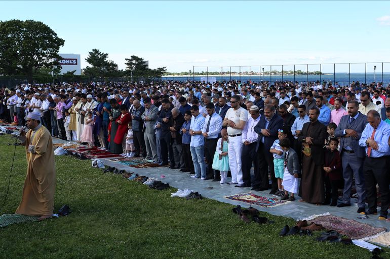 Muslims pray at Bensonhurst Park to celebrate Eid Al-Fitr, the end of the Ramadan, in Brooklyn, New York, U.S., June 15, 2018. REUTERS/Gabriela Bhaskar