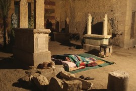 A man sleeps between tombstones in front of his single-room home on a hot night in the Cairo Necropolis, Egypt, October 13, 2015. In the sprawling Cairo Necropolis, known as the City of the Dead, life and death are side by side. Amid a housing crisis in Egypt, and with the population of greater Cairo estimated at about 20 million, people count themselves lucky to have a place to call home in the graveyards that date back hundreds of years. REUTERS/Asmaa Waguih PICTURE 16 OF 20 - SEARCH