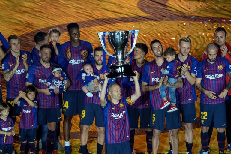 Barcelona v Real Sociedad: La Liga- - BARCELONA, SPAIN - MAY 20: Barcelona's midfielder Andres Iniesta holds Spanish league throphy during the ceremony at the end of the Spanish league football match between FC Barcelona and Real Sociedad at the Camp Nou stadium in Barcelona on May 20, 2018.