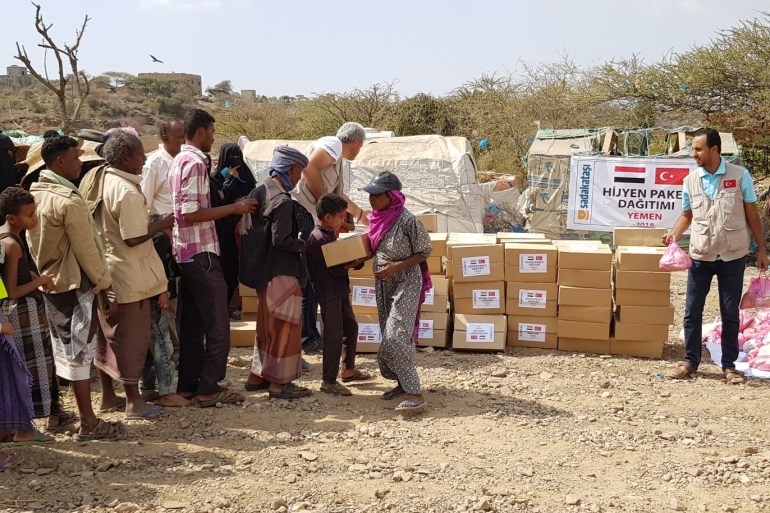 Humanitarian aid distributed to Yemeni civilians- - TAIZ, YEMEN - DECEMBER 16: Yemenis, who have escaped from clashes in Taiz, wait in line to receive humanitarian aid, distributed by a Turkish association, at a camp in Taiz, Yemen on December 16, 2018.