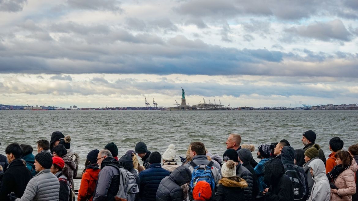 People wait for a ferry to the Statue of Liberty after Governor Andrew Cuomo ordered state tourism funds to be used to keep the state park open during a partial federal government shutdown, in the Manhattan borough of New York City, New York, U.S., December 22, 2018.   REUTERS / David Delgado