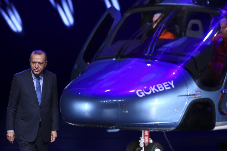 Turkish Defense Industry Summit- - ANKARA, TURKEY - DECEMBER 12: President of Turkey Recep Tayyip Erdogan introduces Turkey's first indigenous multi-purpose helicopter T625 named as 'Gokbey' during the Turkish Defense Industry Summit at the Bestepe People's Congress and Culture Center of the Presidential Complex in Ankara, Turkey on December 12, 2018.
