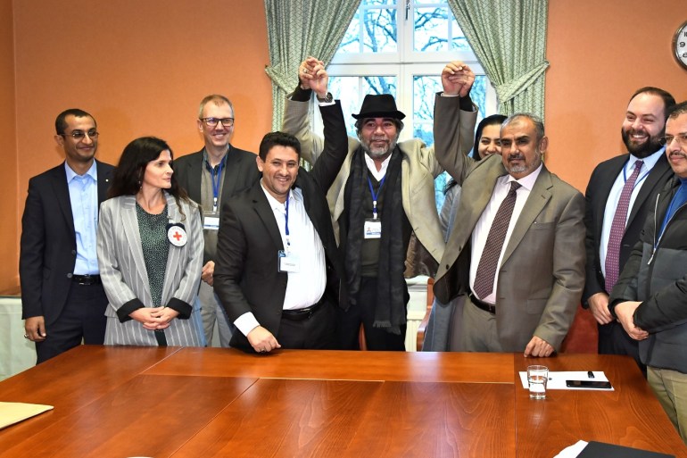 At left, Abdelqader al-Murtada and Saelem Mohammed Noman Al-Mughalles, representatives of the Ansar Allah delegation and at right, Askar Zaeil and Hadi al-Hayi representing the delegation of the Government of Yemen gesture at the negotiating table together with representatives from the office of the U.N. Special Envoy for Yemen and the International Red Cross Committee (ICRC) after lists of prisoners were exchanged, a first step to implement the agreement to release all