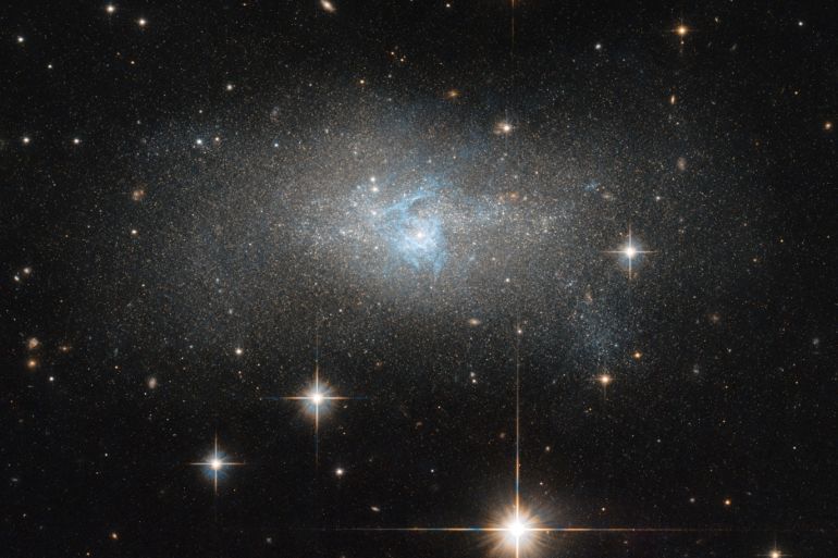 A Hubble Space Telescope image shows bright blue gas threading through the galaxy IC 4870 that shines because it emits radio wave and gamma-ray radiation, in this image obtained September 26, 2018. NASA/ESA/Hubble Space Telescope/Handout via REUTERS THIS IMAGE HAS BEEN SUPPLIED BY A THIRD PARTY. IT IS DISTRIBUTED, EXACTLY AS RECEIVED BY REUTERS, AS A SERVICE TO CLIENTS