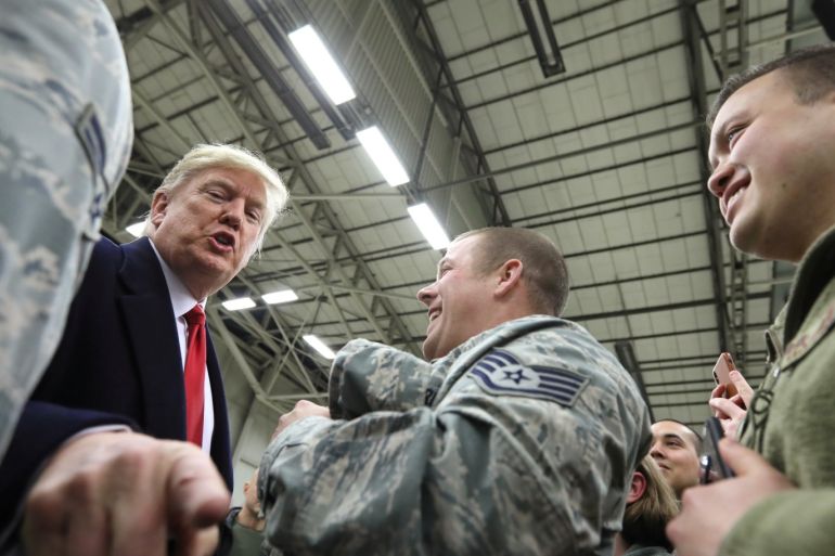 U.S. President Donald Trump gestures as he visits U.S. troops at Ramstein Air Force Base, Germany, December 27, 2018. REUTERS/Jonathan Ernst